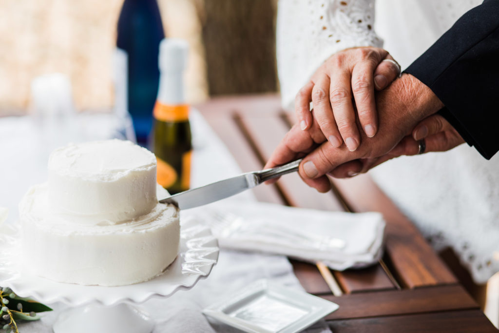 couple cutting a wedding cake