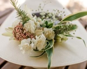 Beautiful wedding bouquet of white flowers with baby's breath and greenery